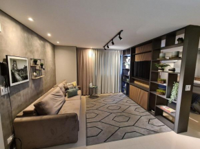 Studio novo, moderno e aconchegante, no centro